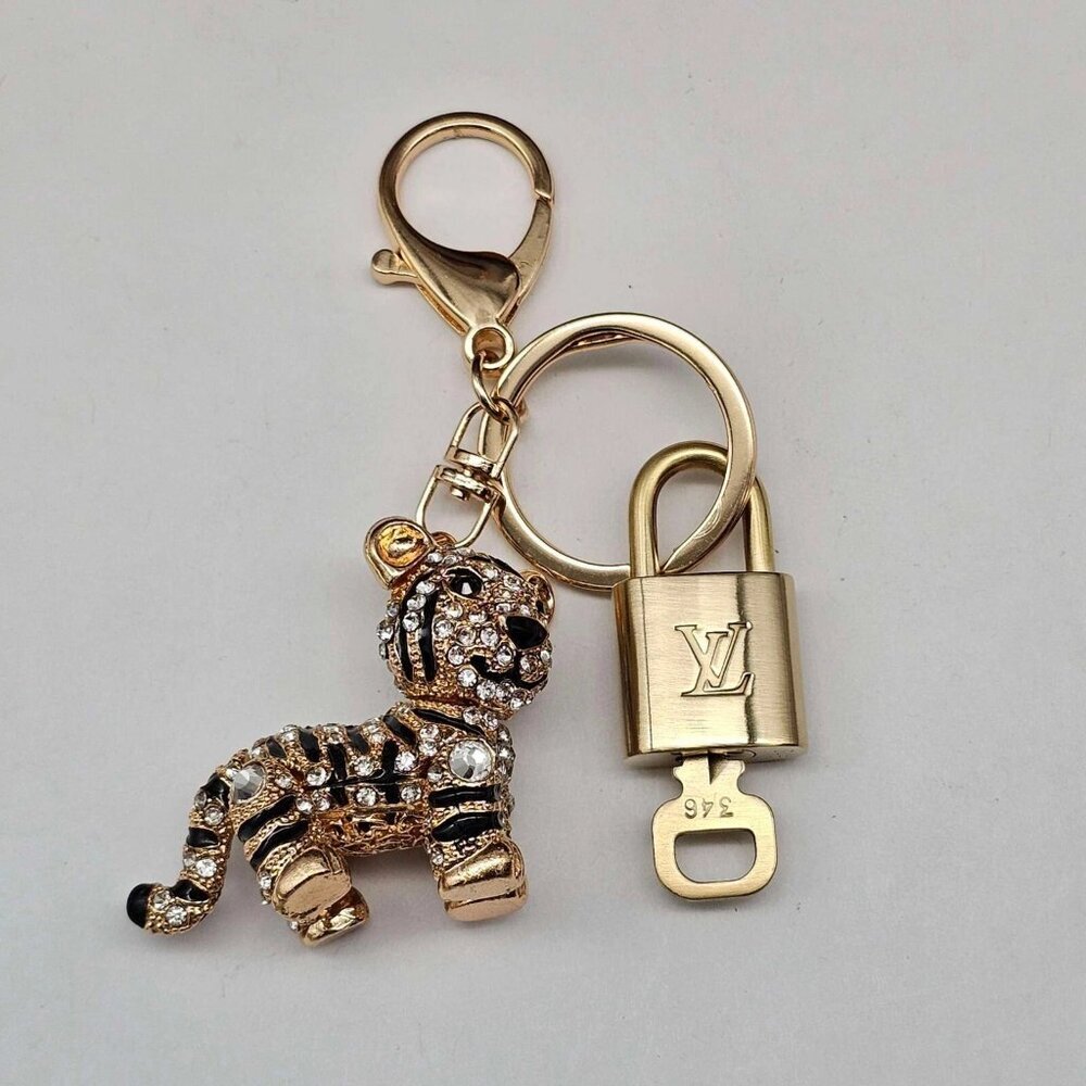 Authentic Louis Vuitton Lock & Key with unbranded Tiger Bagcharm, Keycharm